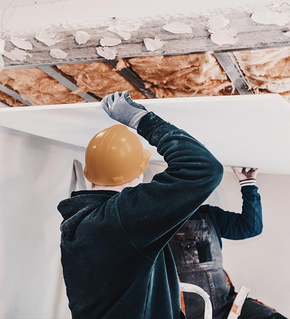 Experienced ceiling installers working on drywall and ceiling upgrades.