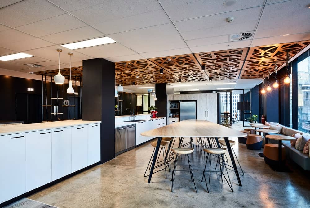 Ceiling design featuring contemporary Heron Ceilings for a sleek, modern workspace.