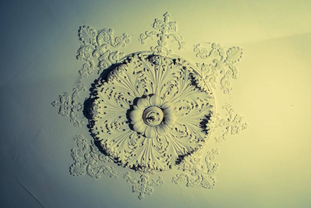 Ceiling medallion with intricate floral patterns for decorative ceilings in homes and offices.