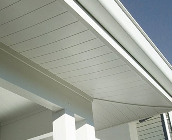 Modern white ceiling design with smooth paneling and clean lines.