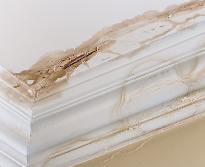 Ceiling with damage needing repair and decorating by Heron Ceilings.