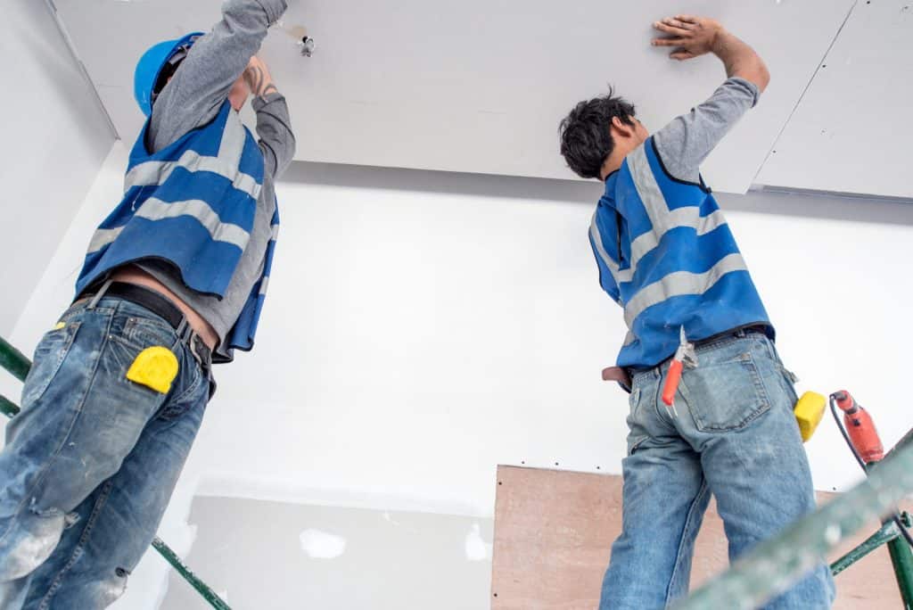 Ceiling installation professionals working on new ceilings in residential or commercial properties.