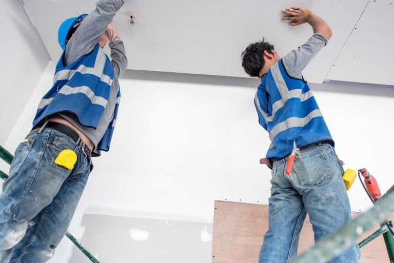 Ceiling installation professionals working on new ceilings in residential or commercial properties.