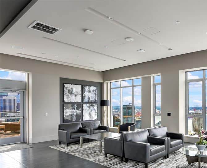 Elegant city apartment featuring Heron ceilings, large windows, and contemporary decor.