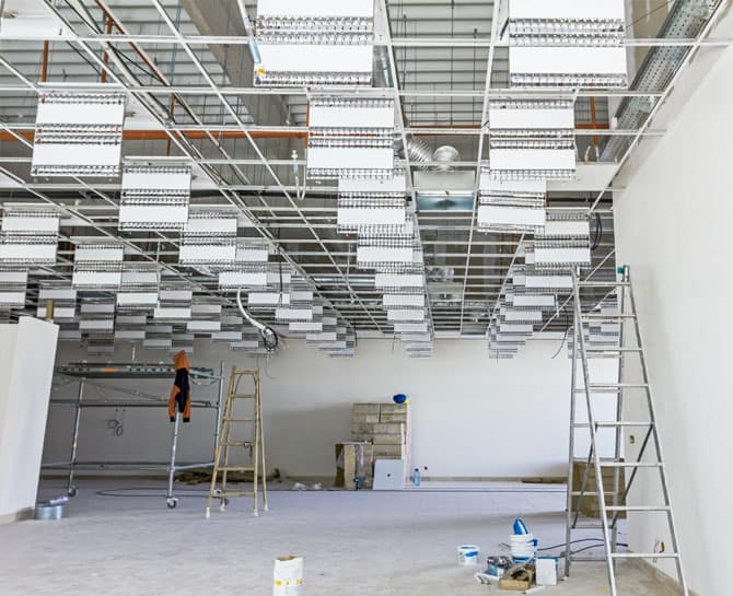 Modern suspended ceiling system installation in progress for commercial interior project.