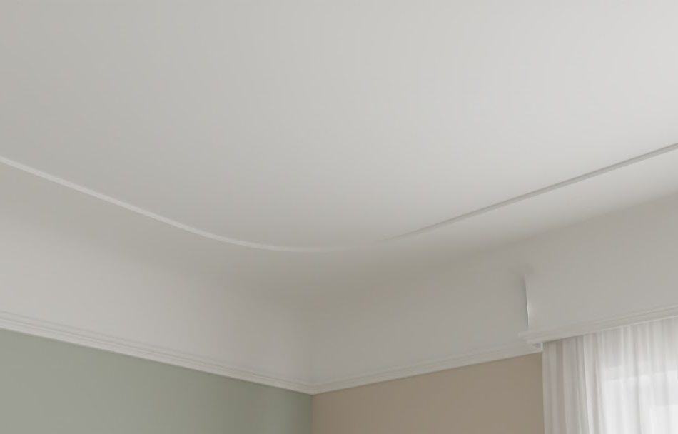 Modern ceiling with smooth white finish and subtle lighting detail in a contemporary home.